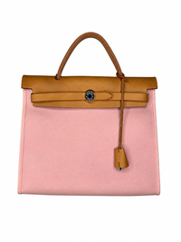 Pre-owned Hermès Herbag Zip 31 in pink canvas with natural Vache Hunter leather, front view with the flap closed, authenticated by MIKUN